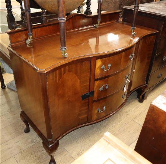 A 1920s mahogany serpentine sideboard W.136cm